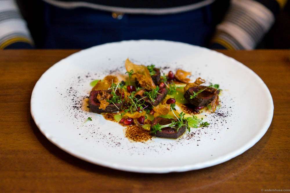 Minke whale from Lofoten, fried ginger, pomegranate, pear purée, soy and butter glace and powder of the Icelandic seaweed "søl"