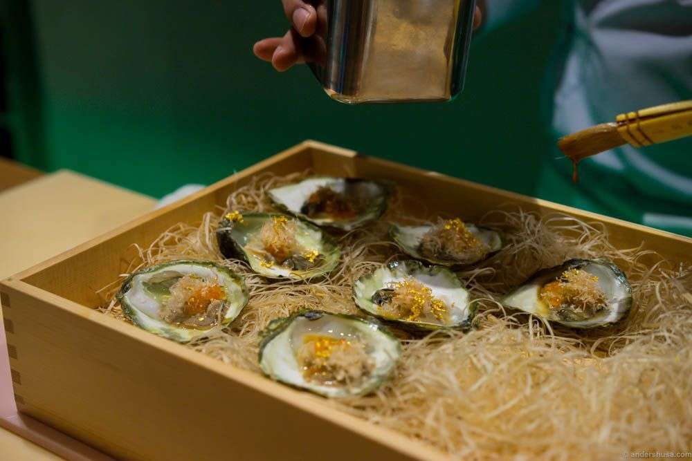 Oysters from Lysefjorden with lumpfish roe, lemon infused trout roe, soya, yuzu, bonito flakes and gold!