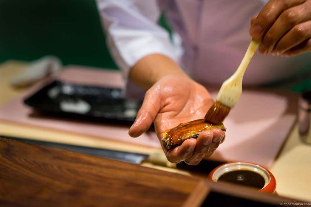 The eel is glazed with unagi sauce before serving. A Japanese tsume sauce, or reduction, of soy sauce, rice wine, sugar and eel broth.