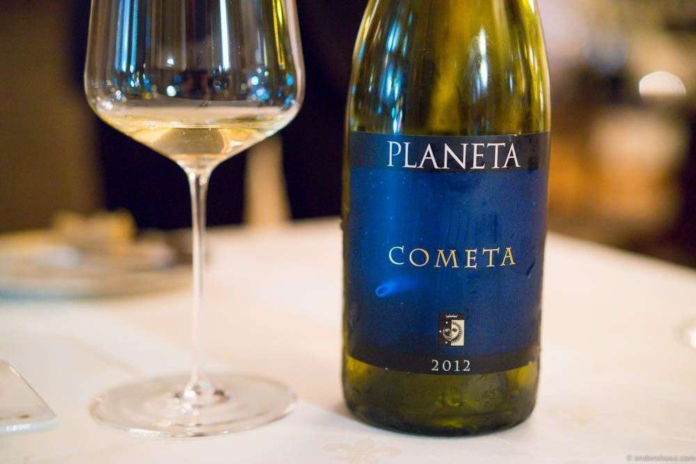 Planeta Cometa 2012. Love the name! Love the label. Love the taste! Green and yellow in color. Butter smooth like a good Chardonnay. A great pairing with the food.