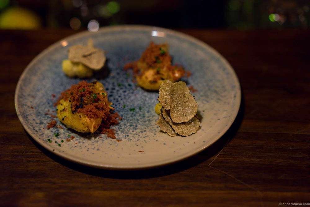 Grilled cauliflower with truffle mayo and summer truffles. Fried sourdough with duck liver mousse and shavings of smoked elk heart on the plate "Havskum" (seafoam)