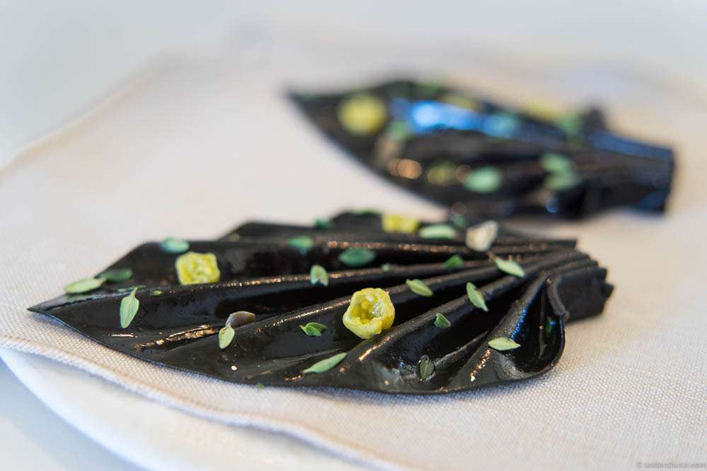 Black garlic is made into a puree, which is dried and shaped into this flower. It has a leather-like texture