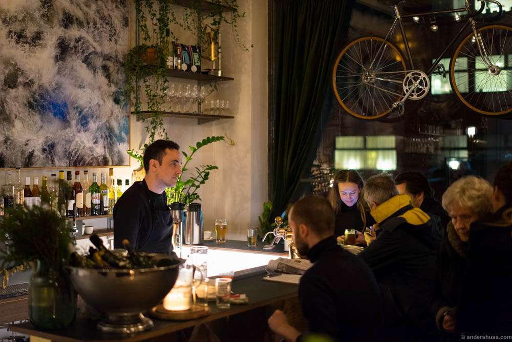 The photo behind the bar is by the artist Behzad Farazollahi
