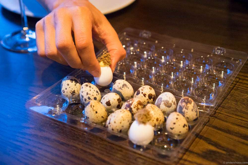 Quail egg and summer truffle. Careful, better pick the edible ones!