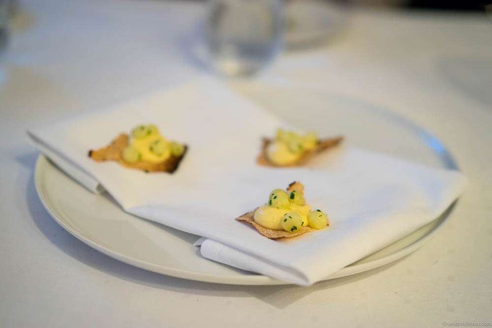 Burnt flatbread with an emulsion of smoked haddock, with potato and chives