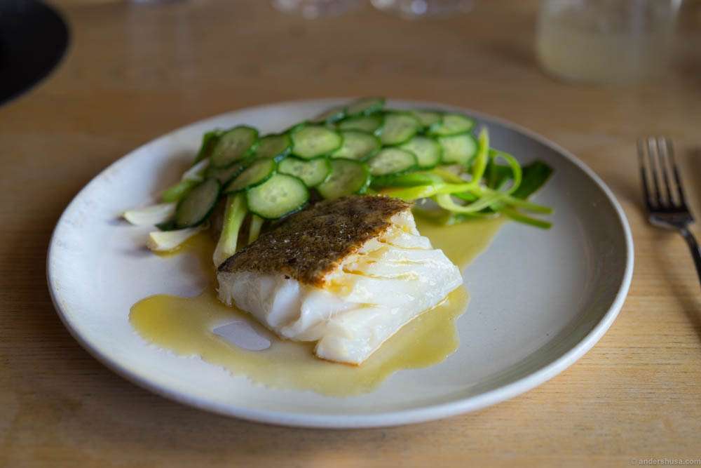 Cod with potatoes, fresh garlic, cucumbers and lemon peel