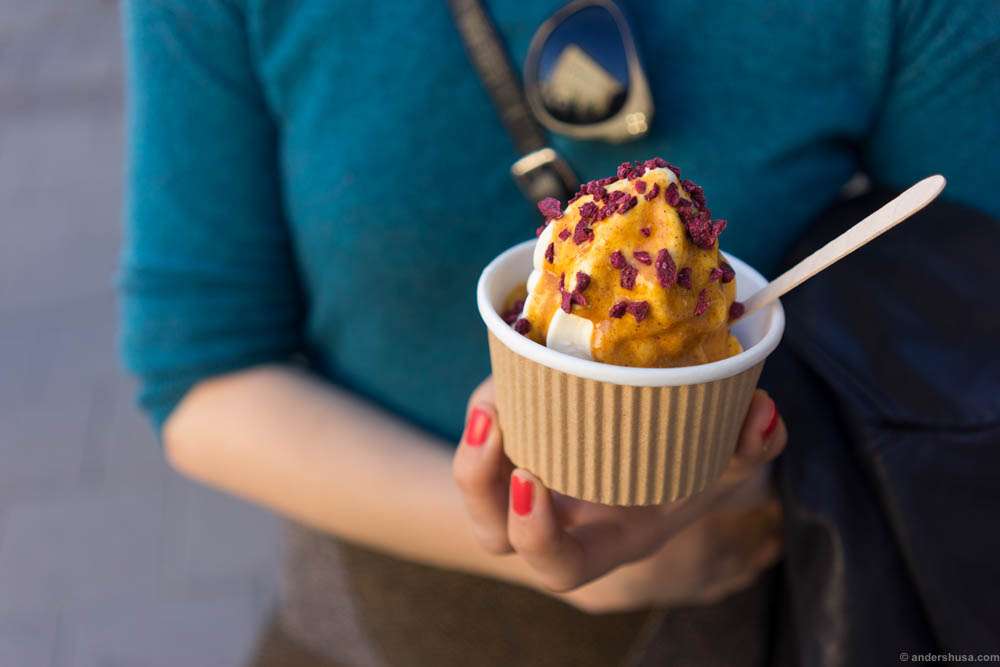 Soft serve ice cream with caramel sauce and freeze-dried blackcurrant