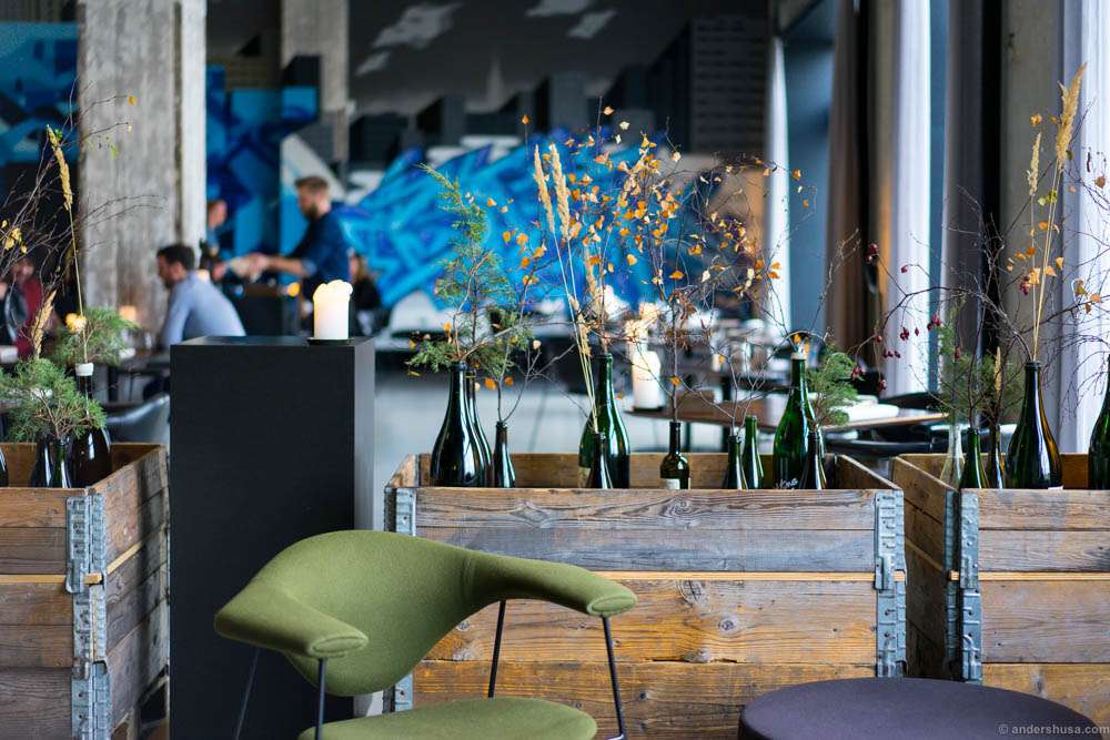 The interior at Amass. Graffiti and wine bottles