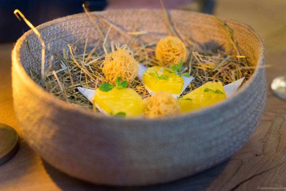 Small snack of crispy potato balls and cured pineapple