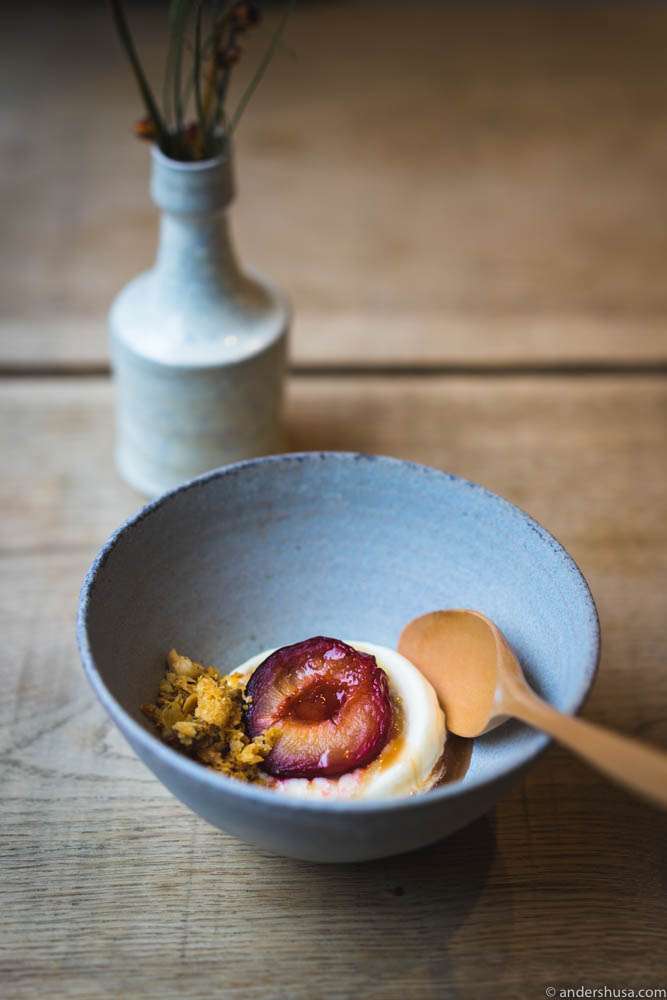 Rosemary ice cream and poached plums, marinated gooseberries, and crushed shortbread with nuts and dried summer flowers.