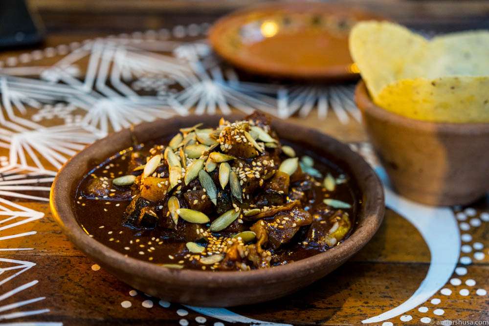 Local mole. Pumpkin, xcatik pepper, oyster mushrooms, chilies, nuts, spices, cacao, rice and plantain