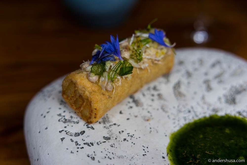 Deep-fried puff pastry with stockfish, söl mayo, fermented lemon zest, cornflower, and sea lettuce at Araktaka.