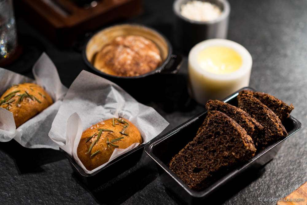 The bread & butter serving. Foccacia, sourdough, and rye (black bread) with artisan butter & pork fat with crackling