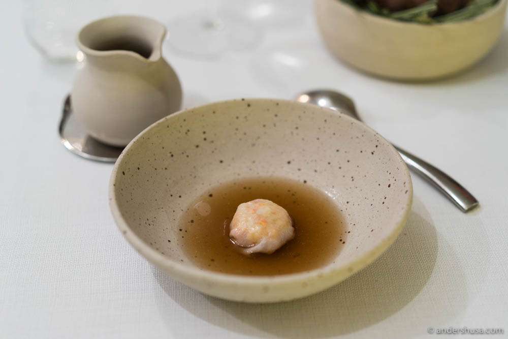 Lobster claws wrapped in a lardo dumpling with a seaweed dashi