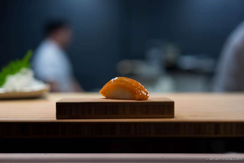 Seated at the chef's counter for the omakase nigiri pieces! Starting with salmon and soy dashi