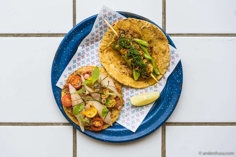 Tostada with mackerel, salsa, and fresh tomatoes and taco with grilled mussels and hazelnut curry.