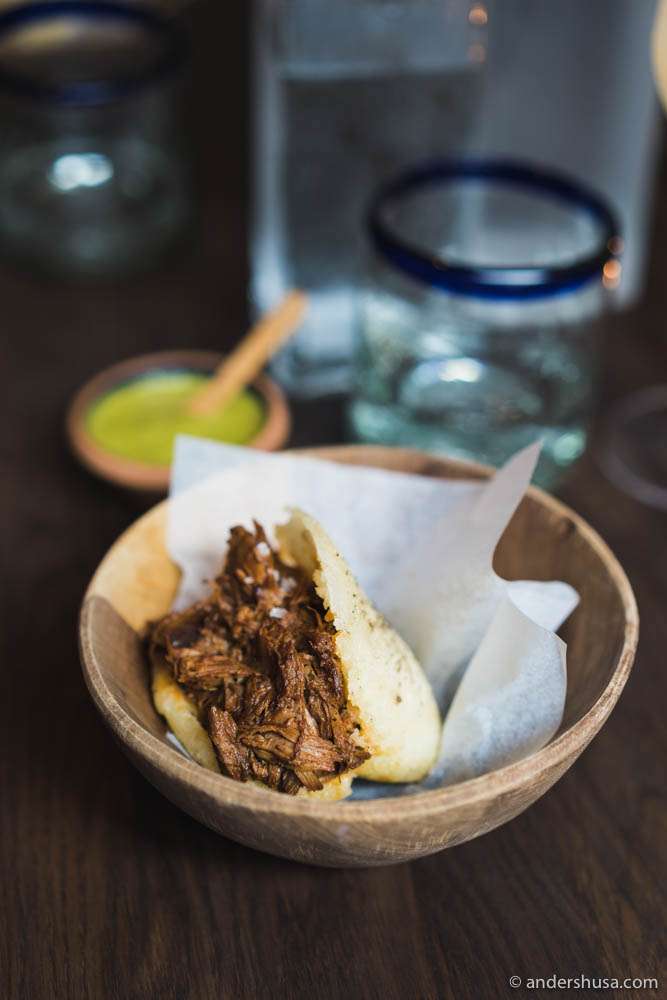 Arepas with braised and smoked lamb served with Venezuelan Guasacaca sauce (avocado salsa)