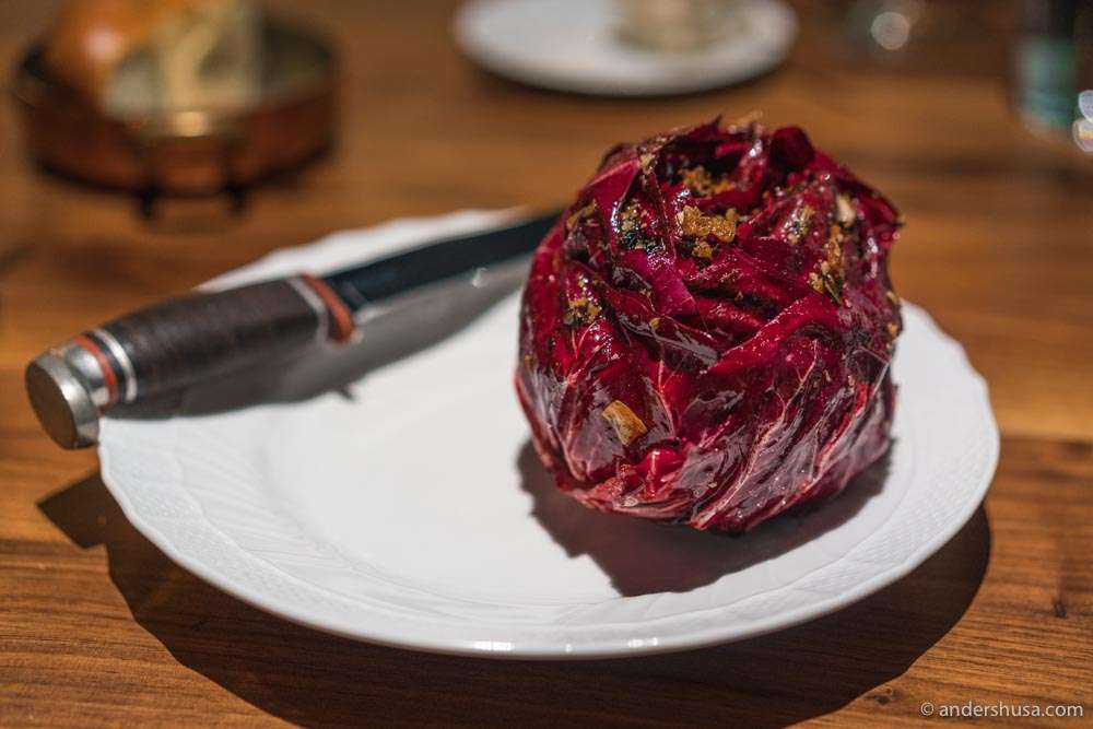 A grilled radicchio dressed in radicchio X.O. sauce.