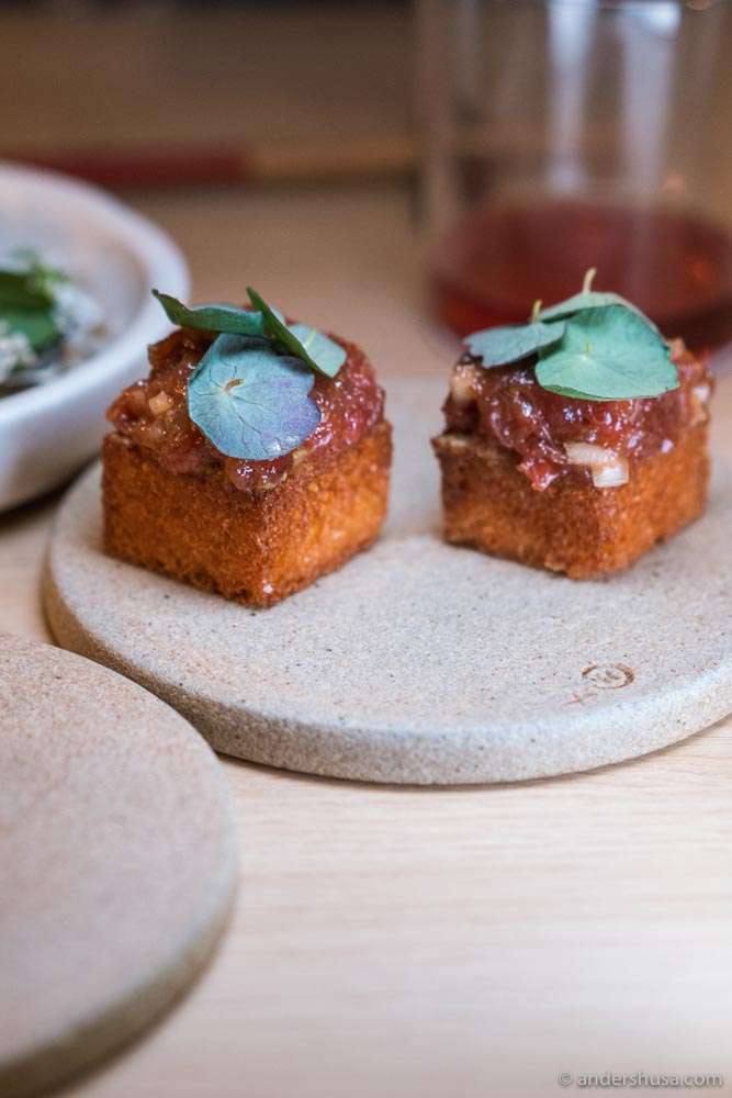 Blue fin tuna, nasturtium, tomato, and anchovy chili sauce.