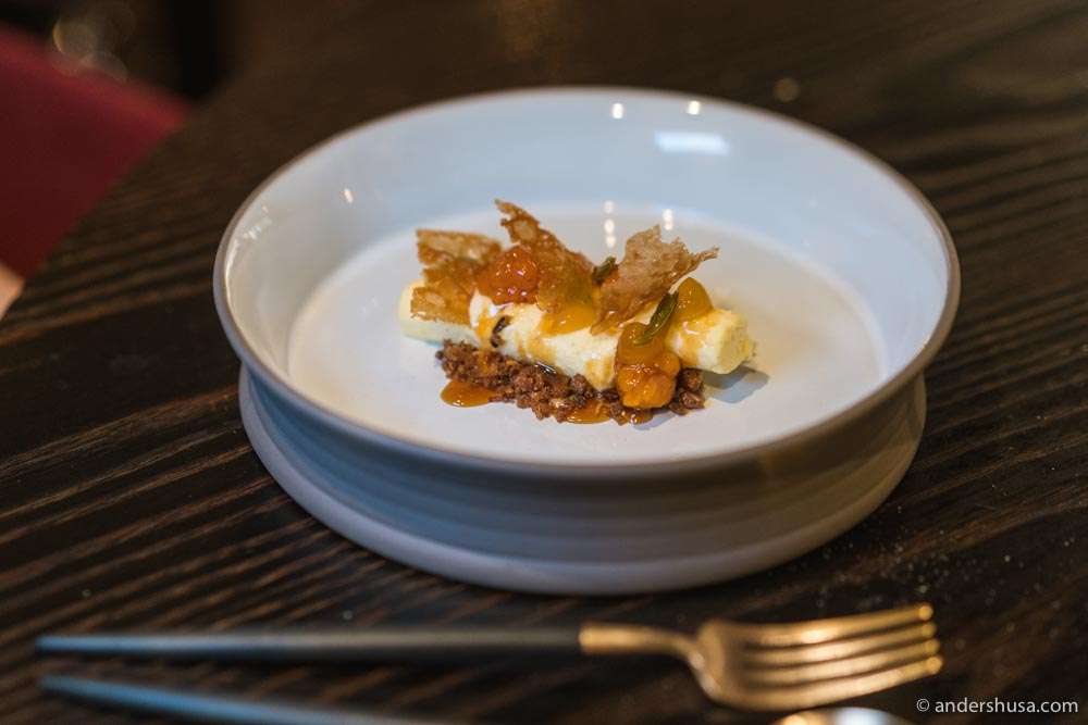 Cloudberry dessert with rye mousse, rye crisp, pine shoot syrup, and beer vinegar.