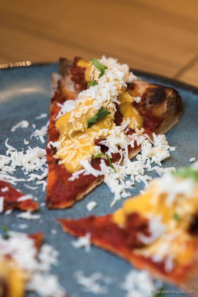 Another creative pizza comes topped with an Indian curry.