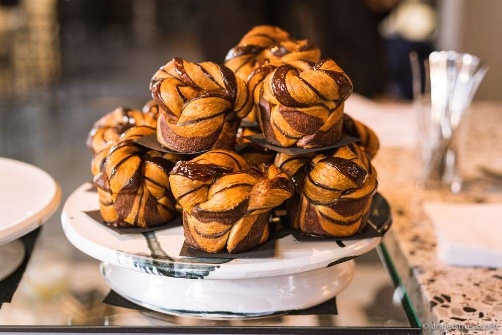 A stack of chocolate swirl croissants.