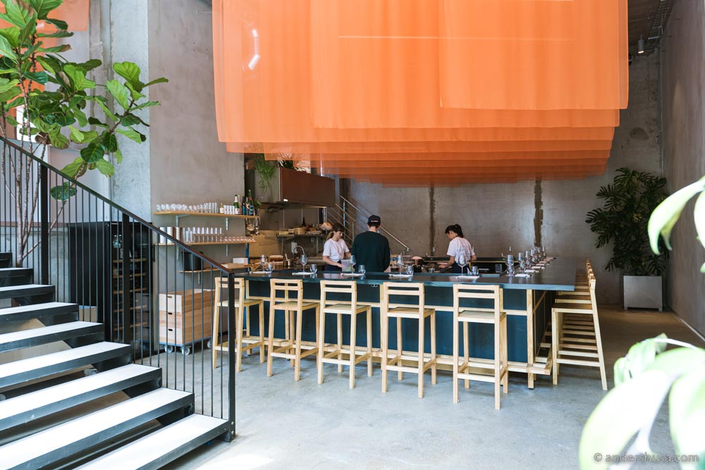 The U-shaped ramen bar downstairs at kōnā.