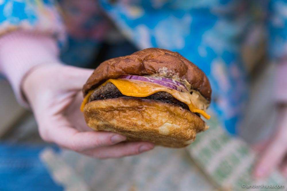 Potato bun, organic beef, cheddar cheese, onions, and beef garum.