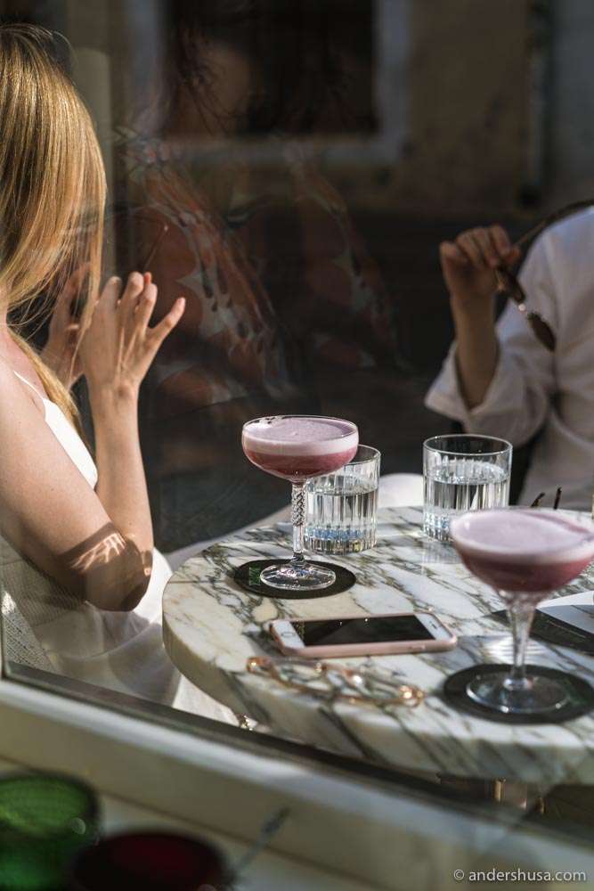 Artisanal cocktails in vintage glasses.