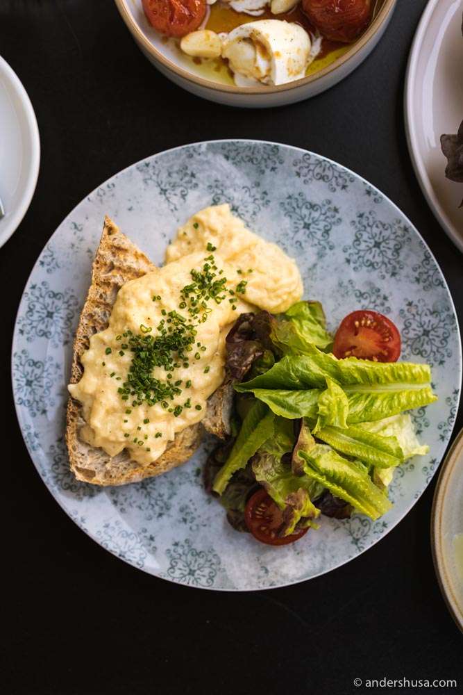 Delicious scrambled eggs served on their sourdough bread.