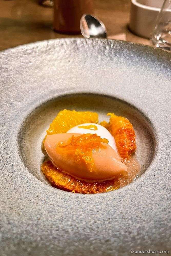 Blood orange sorbet with candied zest, cream, and orange.
