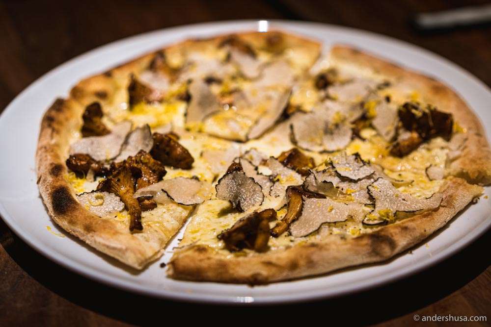 Pizza with chanterelles, truffle, & lemon zest.