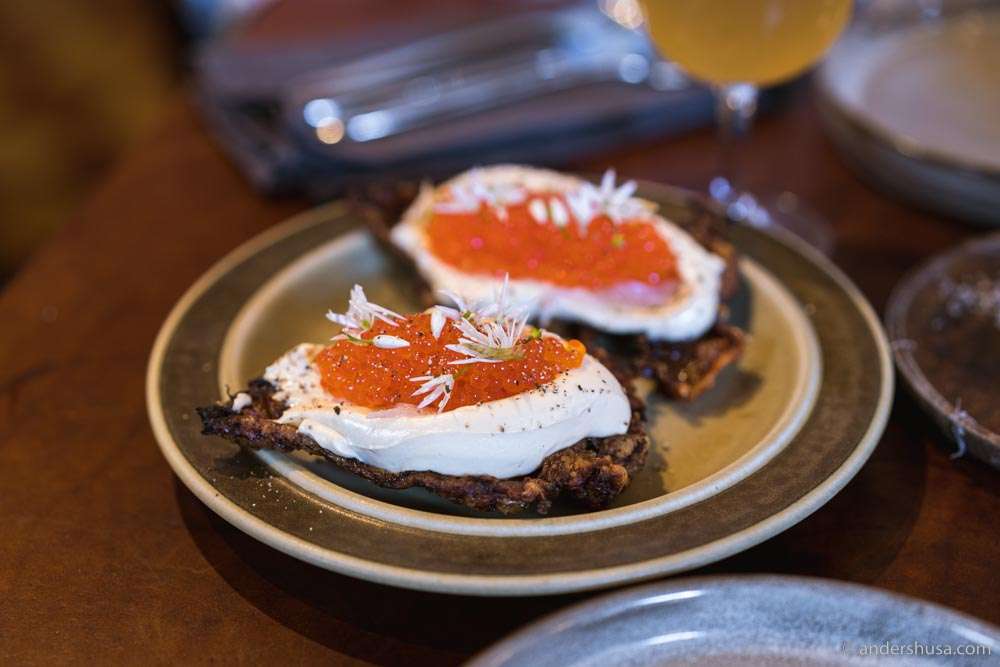 Crispy chicken skin with cream and trout roe.