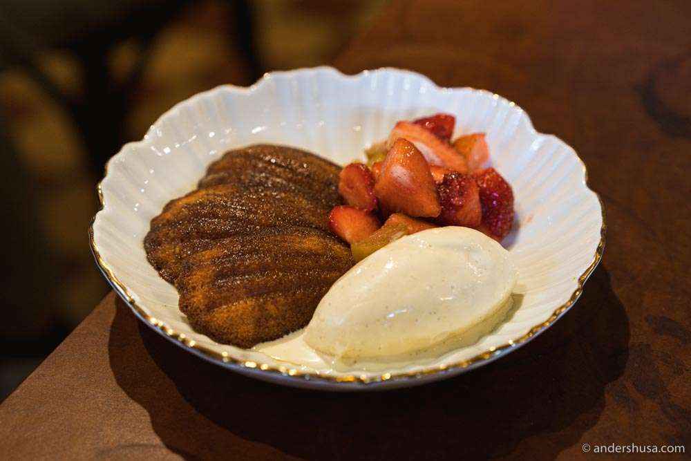Madeleines with strawberries and blackcurrant leaf ice cream.