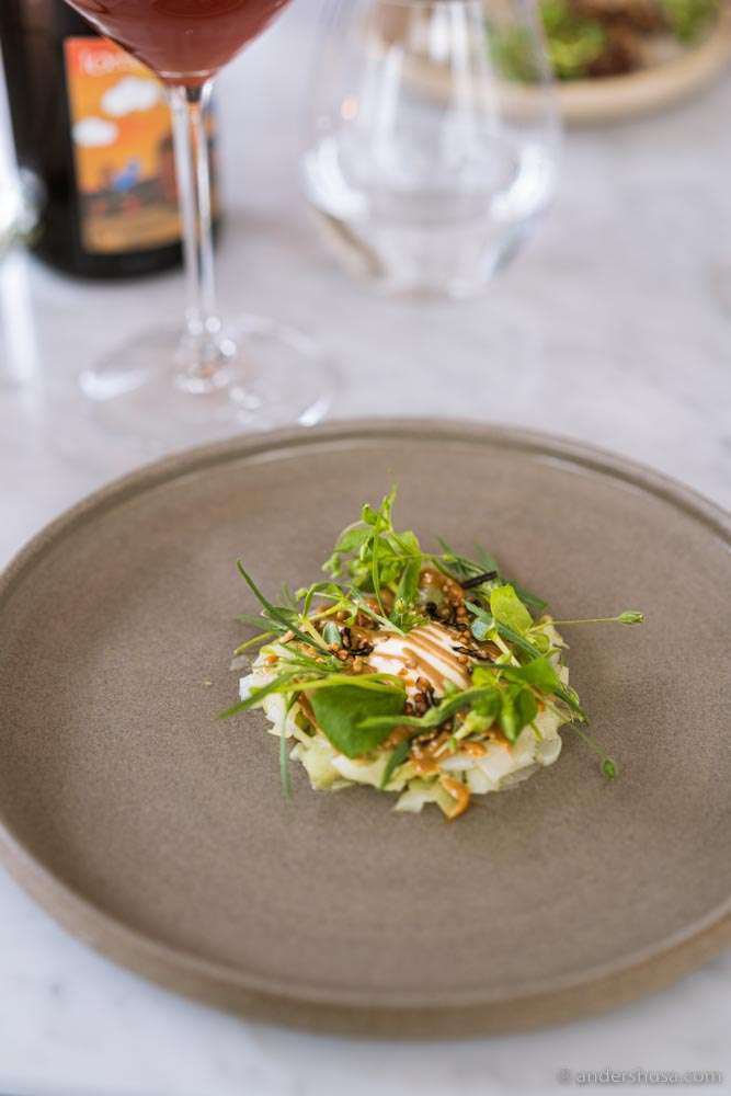 Leek tartare with miso mayo, ramson oil, & wild herbs.