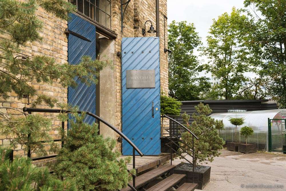 The iconic blue door of Max Cekot Kitchen.