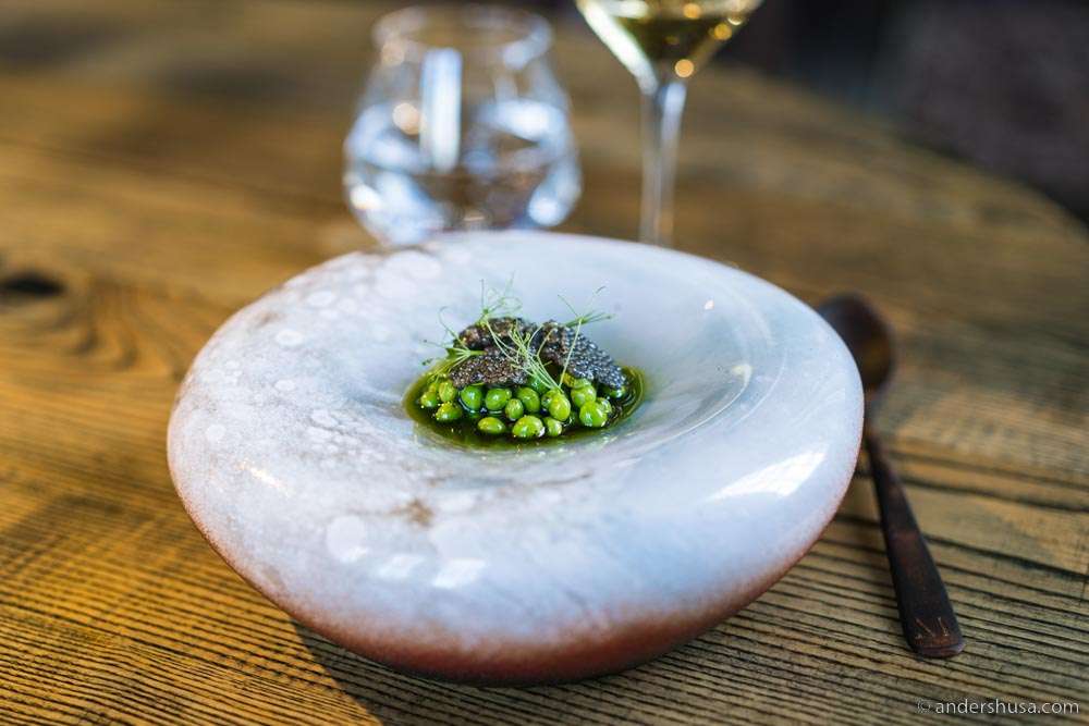 Peas, goat cheese, quail egg yolk, and caviar.