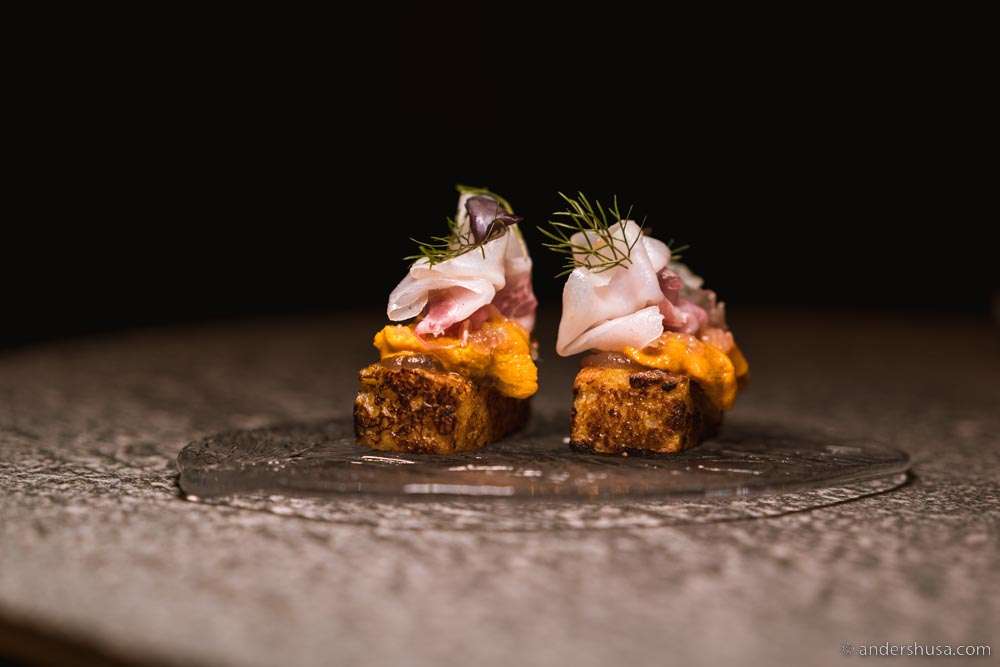 Brioche bread, topped with fermented plum jam, sea urchin, finger lime, & lardo.